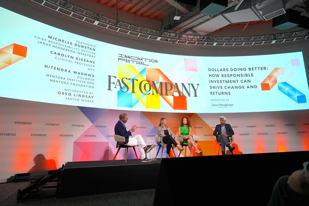 Panelist speaking to Hitendra Wadhwa on stage at Fast Company event