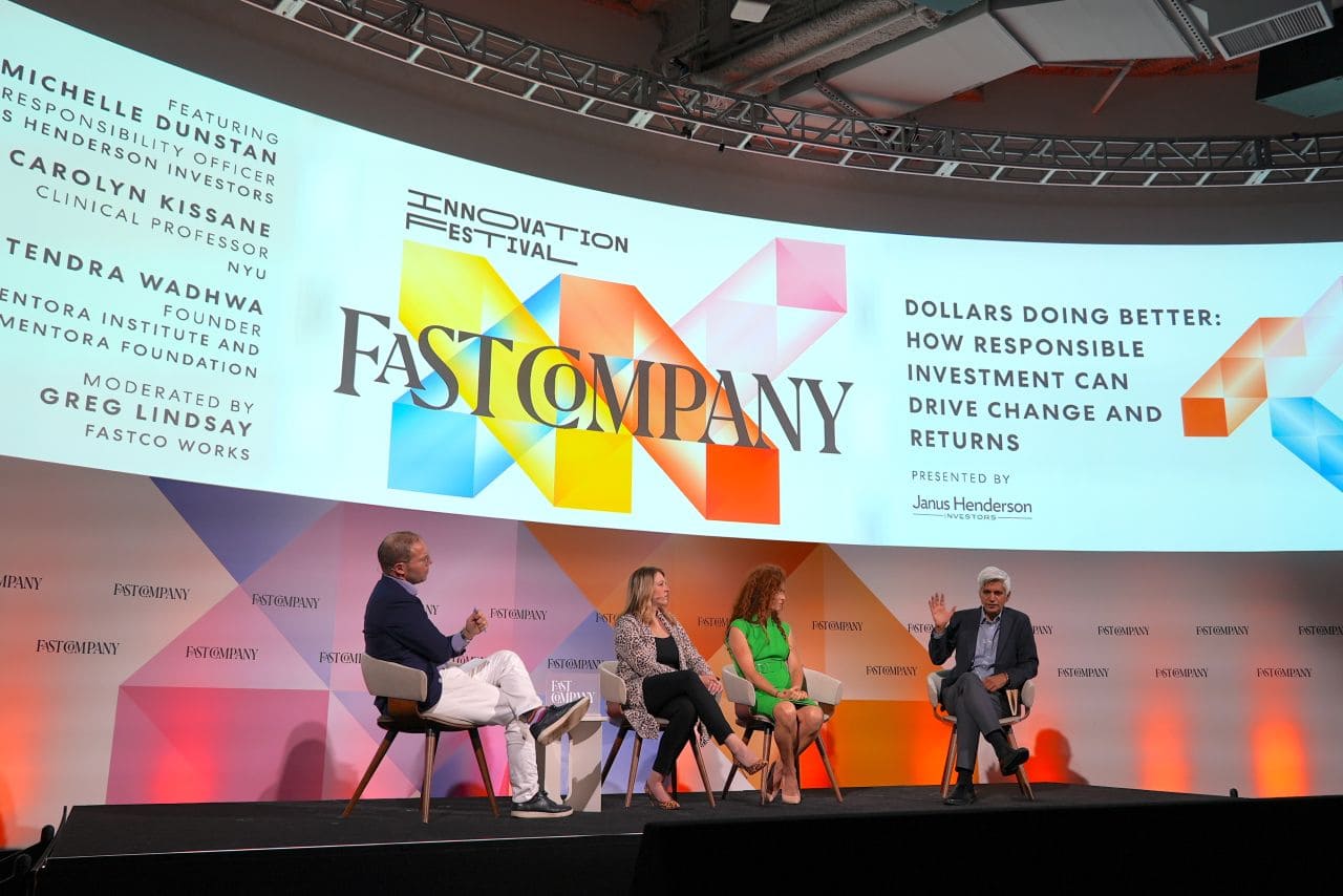 Hitendra Wadhwa speaking with panelists on stage at Fast Company event